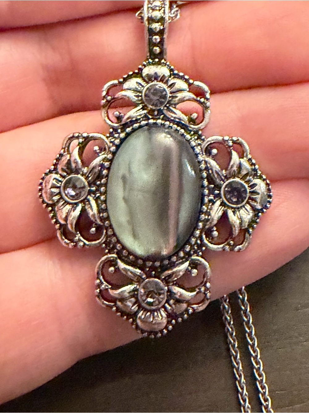 Ornate Silver-Tone Floral Pendant Necklace with Gray Oval Cabochon